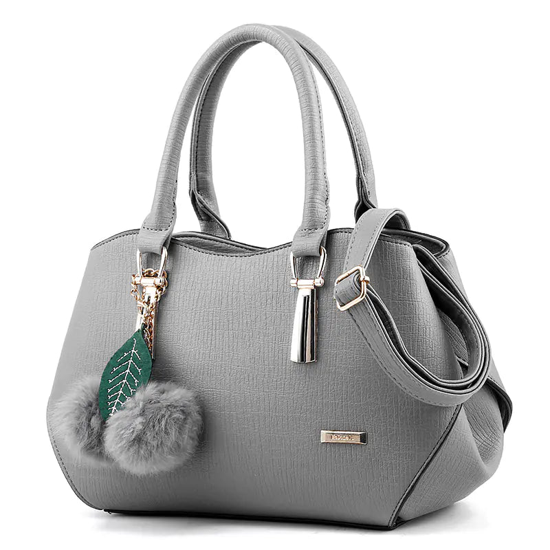 2025 luxury Fashionable Trendy Hanging Pom Pom Tote Bag